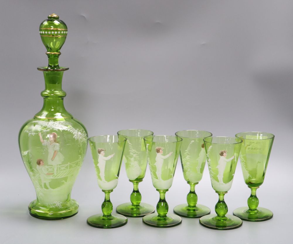 A Victorian Mary Gregory decorated green glass decanter, height 33cm and six tumblers